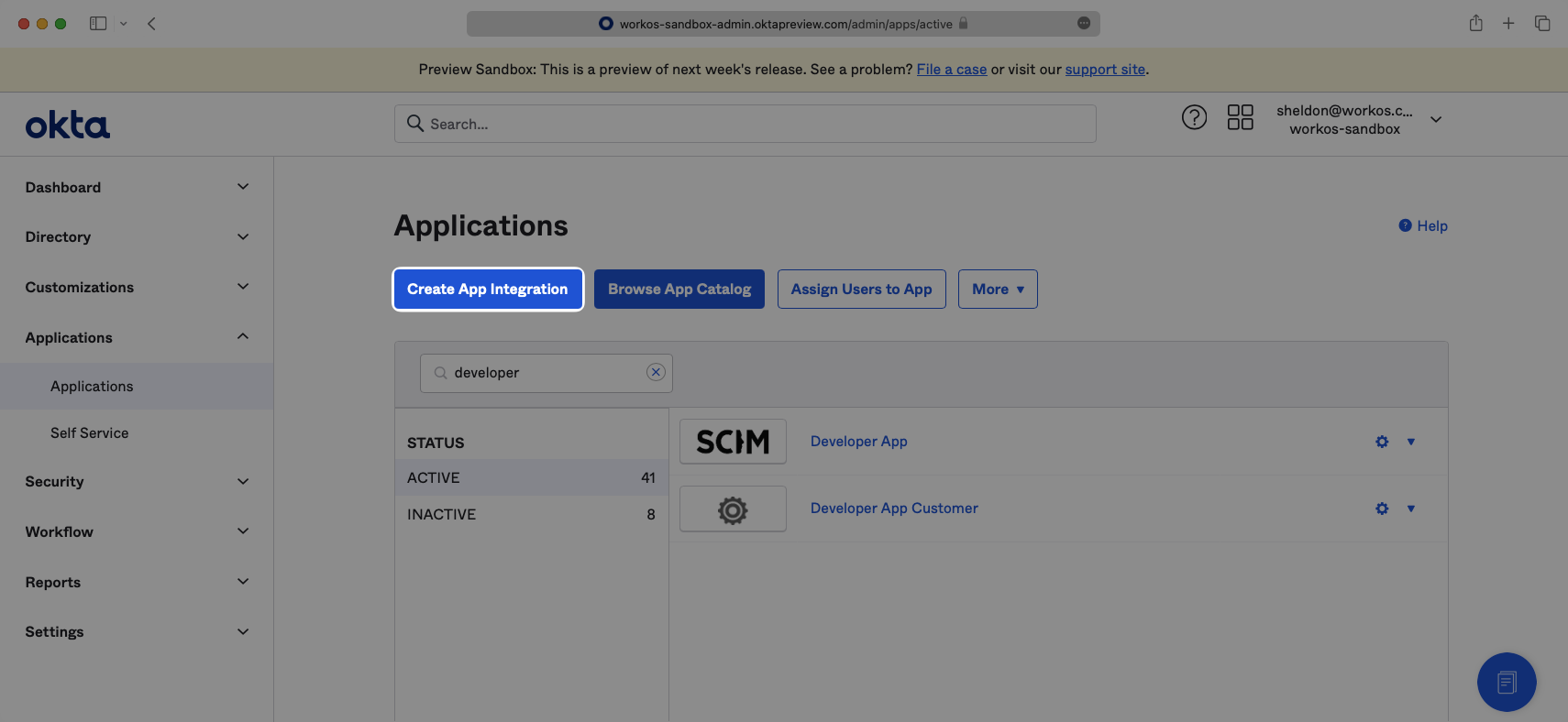 A screenshot showing how to select "Create App Integration" in the Okta Dashboard.